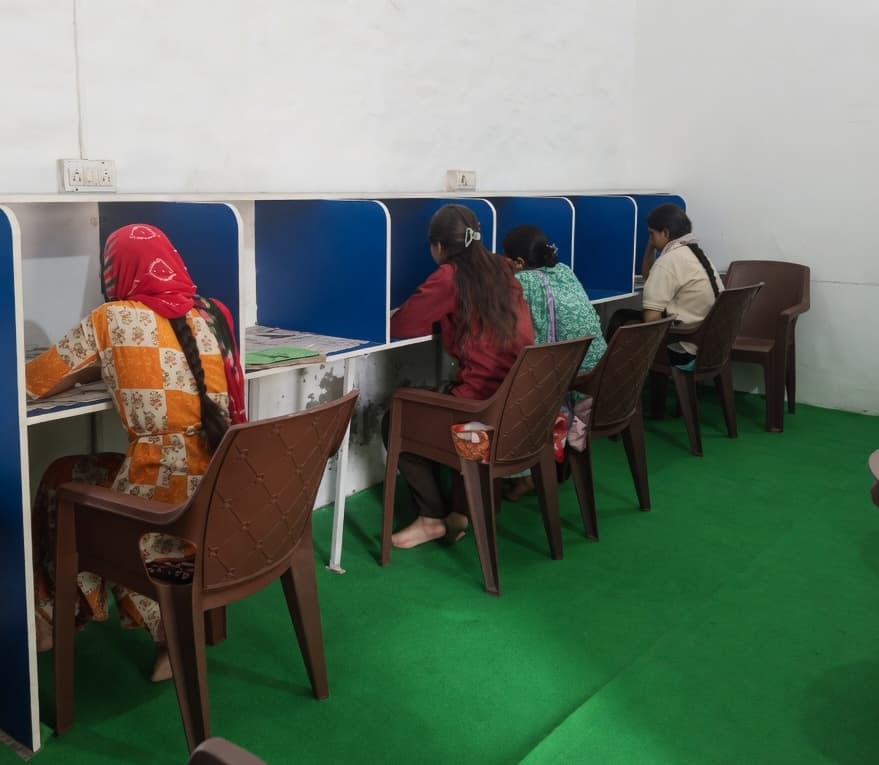 Girls studying at individual desks in the Sunehari Devi Girls Library